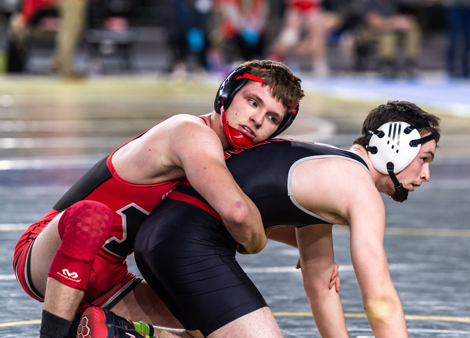 Yelm’s Lake Harris, 145 pounds, competes against North Central’s Tommy Elliott at Mat Classic XXXIV on Friday, February 17, 2023, at the Tacoma Dome. (Joshua Hart/For The Chronicle)